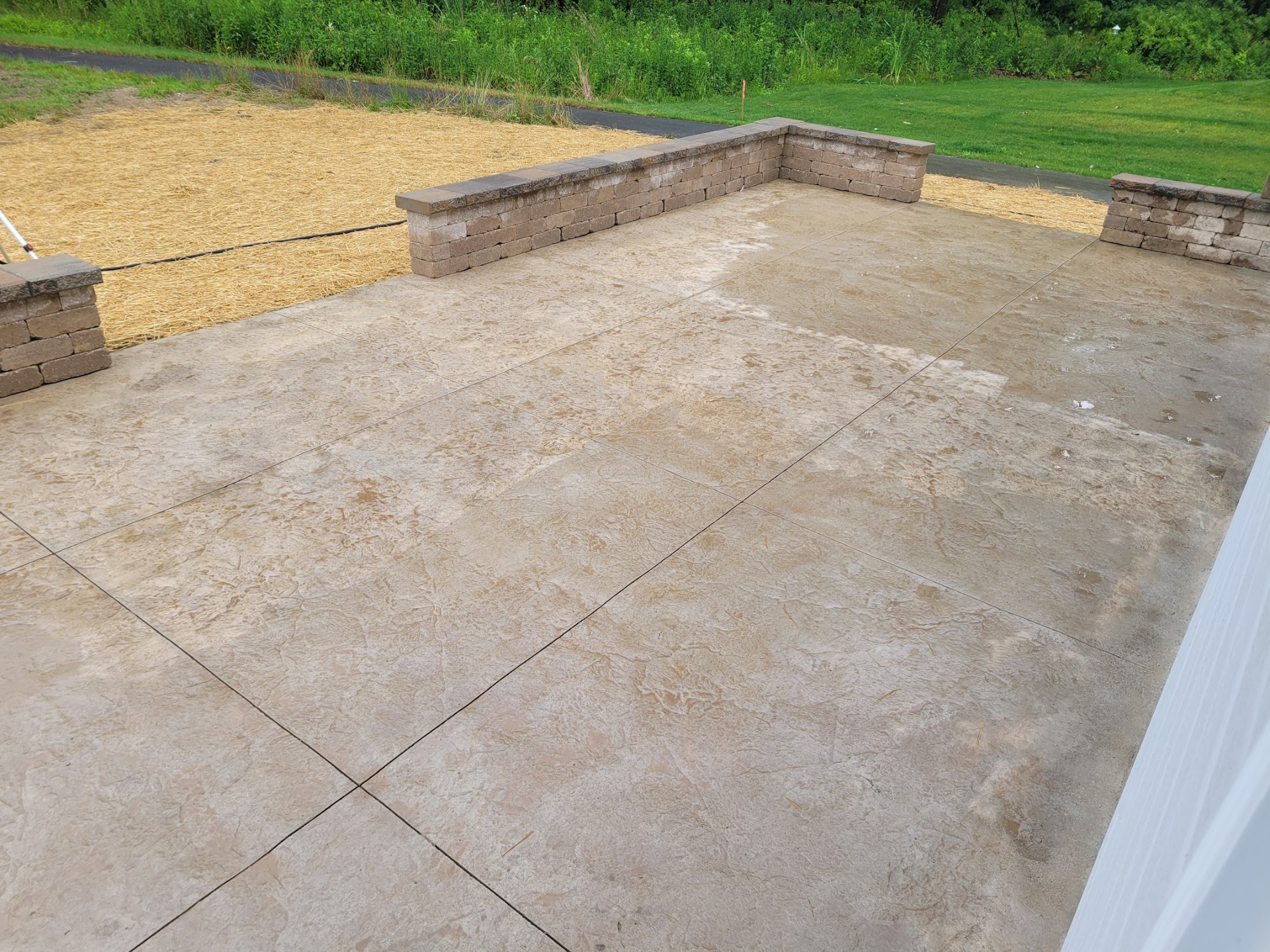 Stamped concrete patio with seat walls